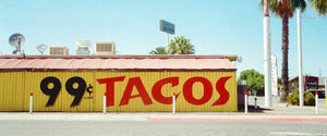 A sign advertising 99 cent tacos.