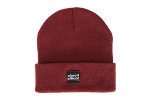 Front view of a maroon colored beanie