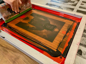 A silkscreen of High Noon being printed.