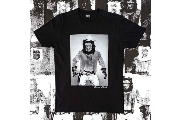 The High Noon black shirt depicting a cowboy gorilla on a screen printed poster background.