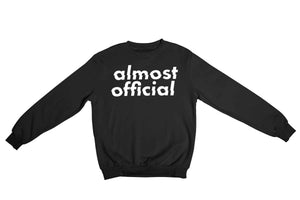 A black Almost Official glitch logo crewneck sweatshirt on a white background.