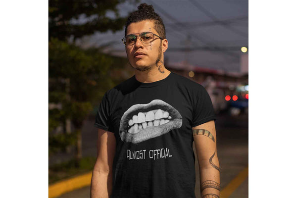 A man wearing the Pearly Whites shirt depicting a crude mouth cutout.