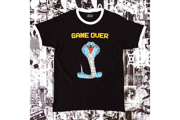 A throwback retro ringer tee with the Cobra Boss shirt depicting a colorful 8 bit cobra and the words Game Over.