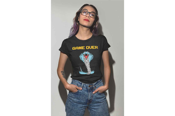 A cool young woman wearing a black Cobra Boss shirt that depicts a colorful 8 bit cobra and the words Game Over.